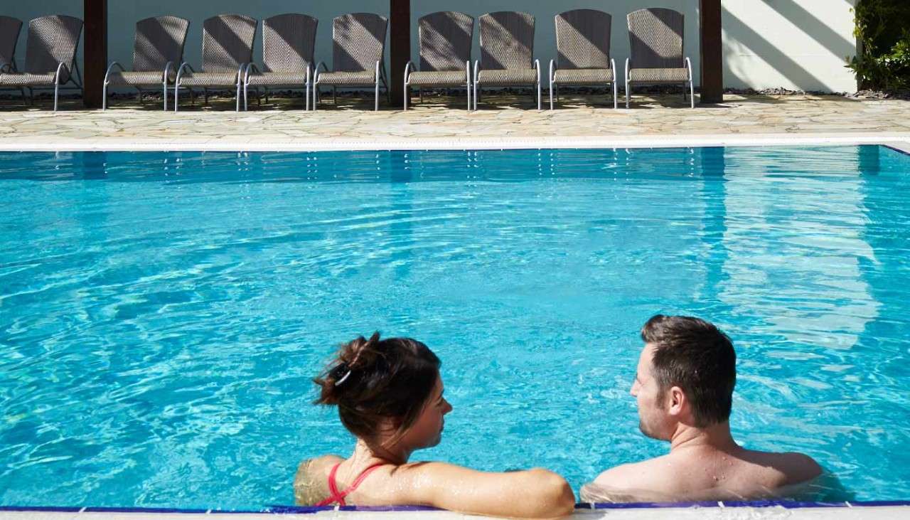 Couple in an outdoor pool