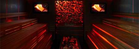 Glowing room with bench seating.