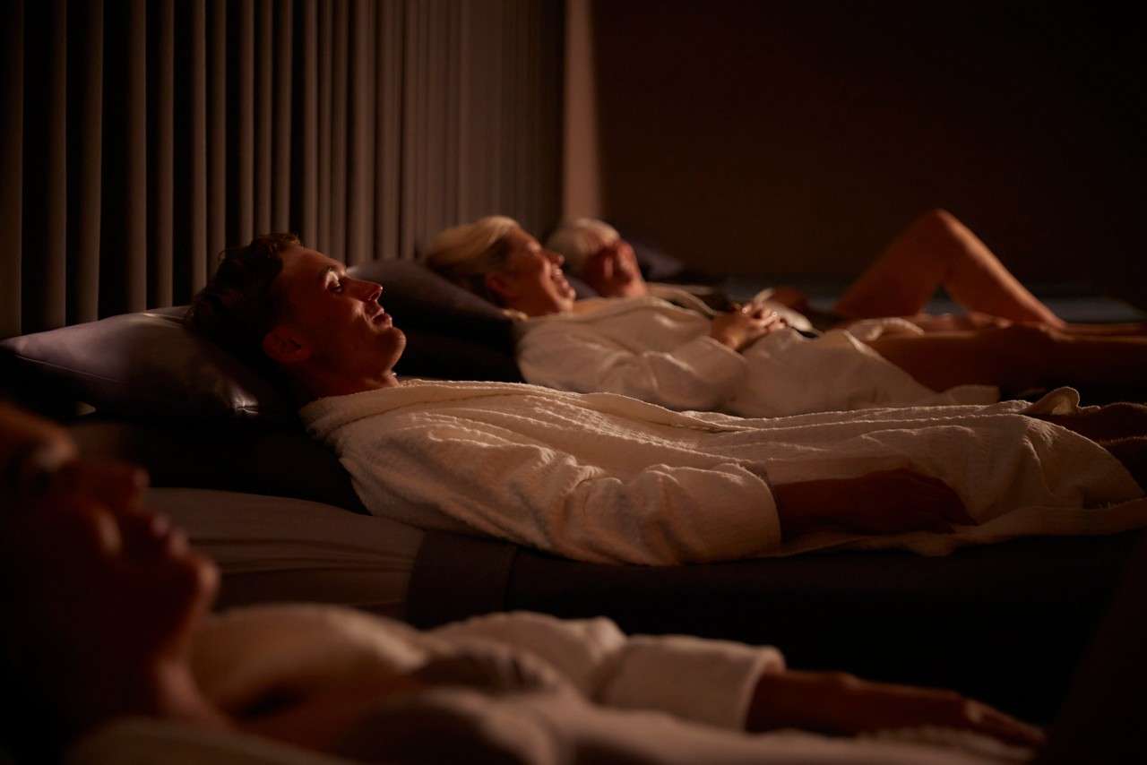 people relaxing on the water beds