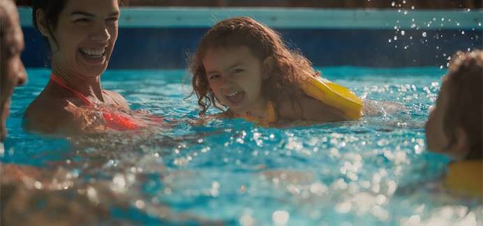 Family splashing in the Subtropical Swimming Paradise pool.