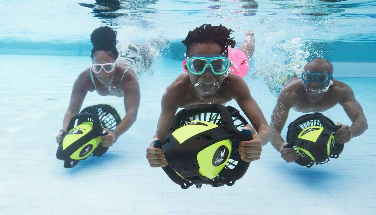 A family enjoying the aqua jets in the pool