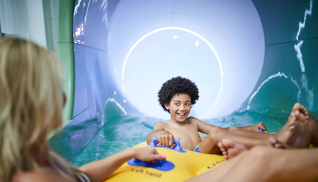 A family on the Tropical Cyclone raft.