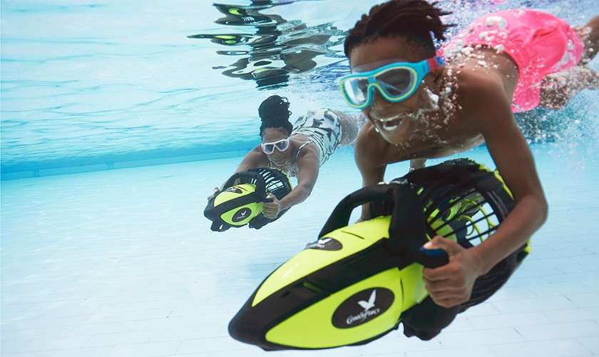 A family on the tropical cyclone slide in the Subtropical Swimming Paradise.