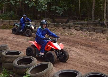 Teenagers on Junior Quad bikes.