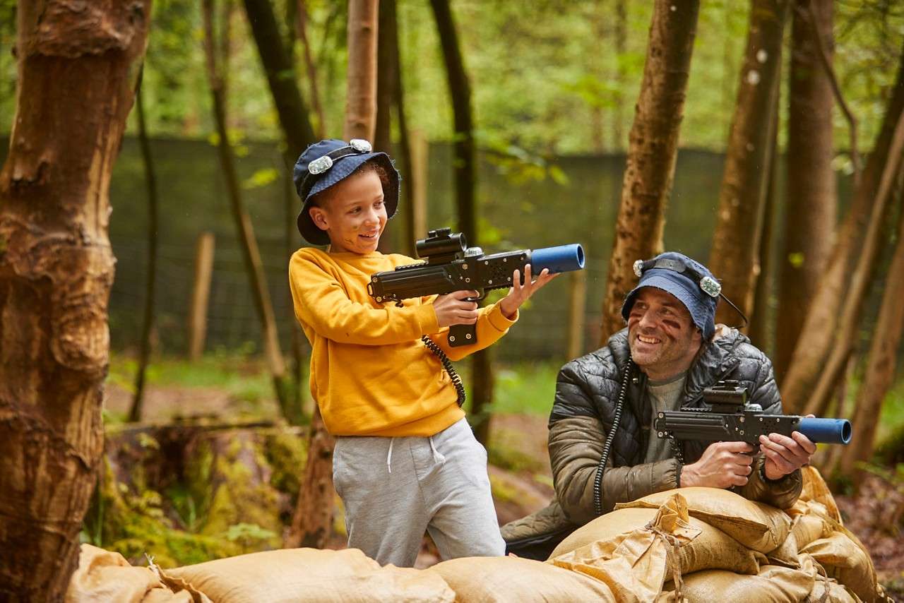 Two people competing in a game of Laser Combat.