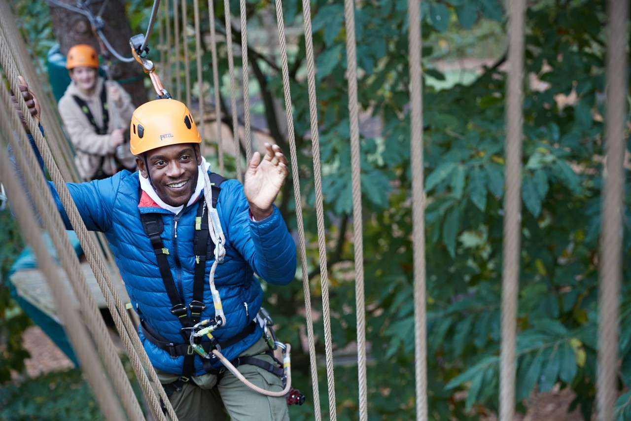 family completing aerial adventure