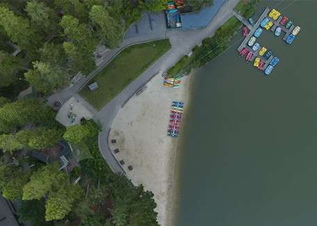 An ariel view of the lake and beach at Longleat Forest.