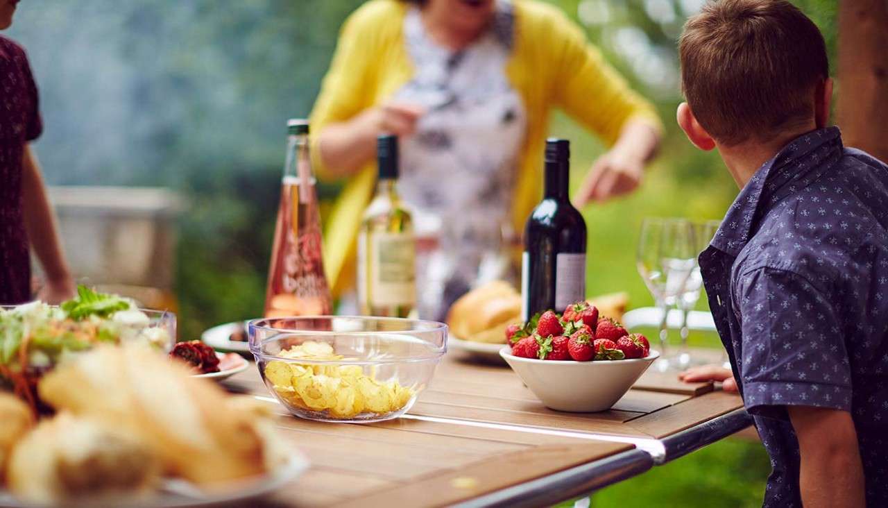 Family having a barbecue outside 
