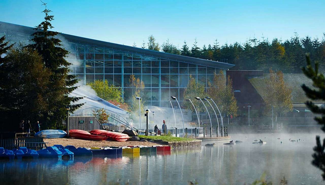 View of lake, beach and Subtropical Swimming Paradise building