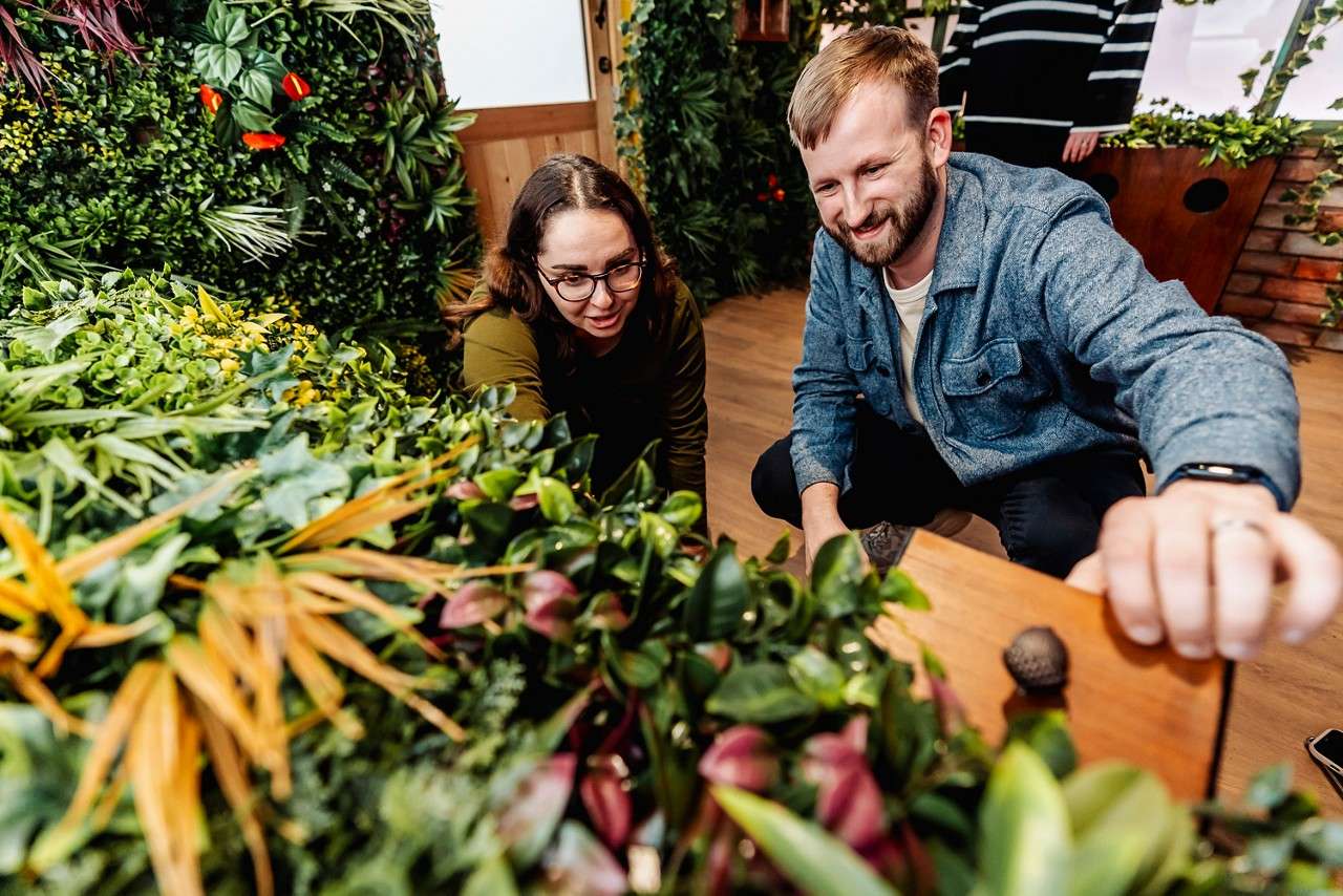 Two people looking for clues in an escape room.