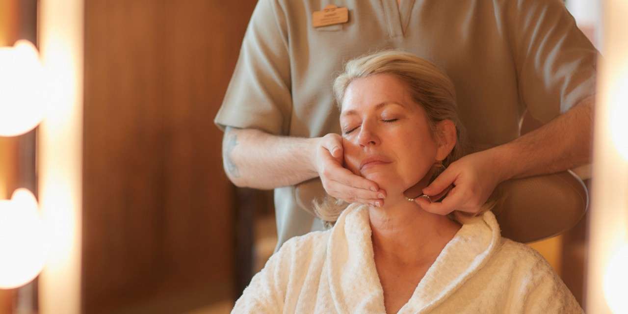 Woman having a sculpting facial massage.