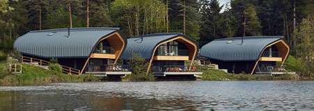 Waterside lodges at Elveden Forest next to the lake.