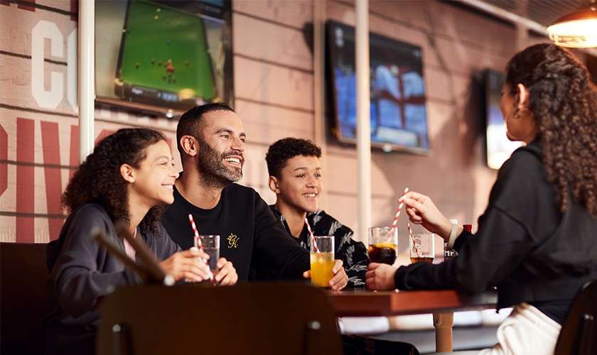 A family sat at the sports cafe