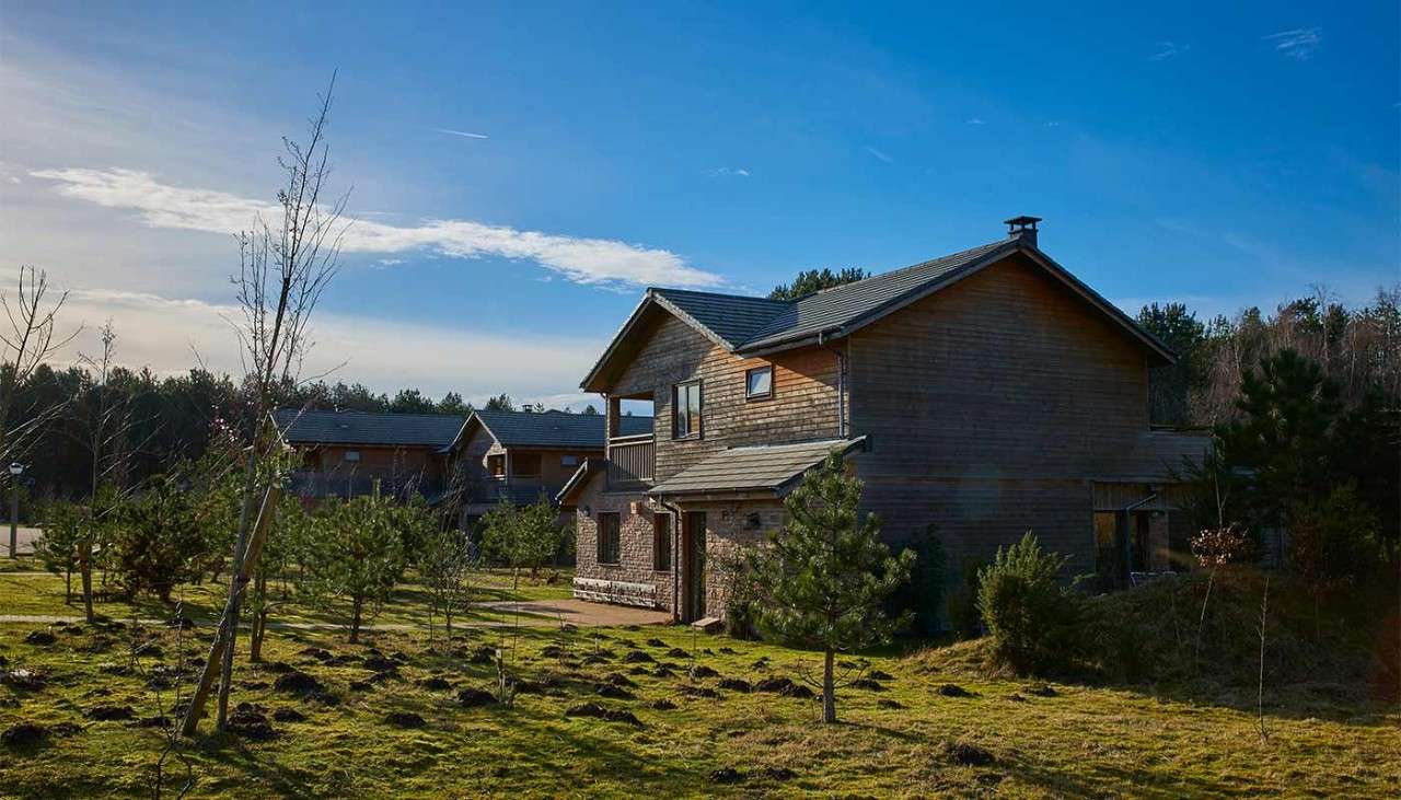 The exterior of an Executive Lodge in the forest