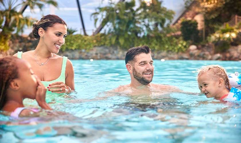 A family splashing in the Subtropical Swimming Paradise