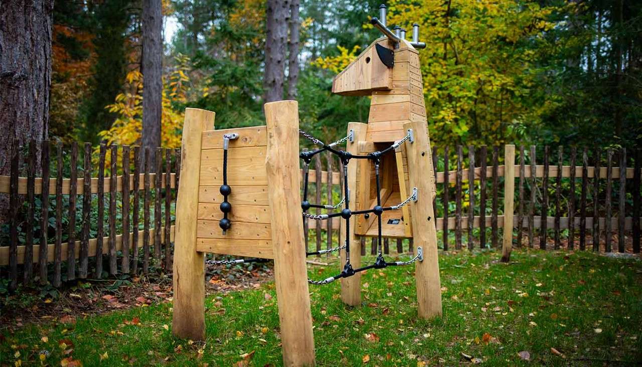 Outdoor wooden climbing frame.