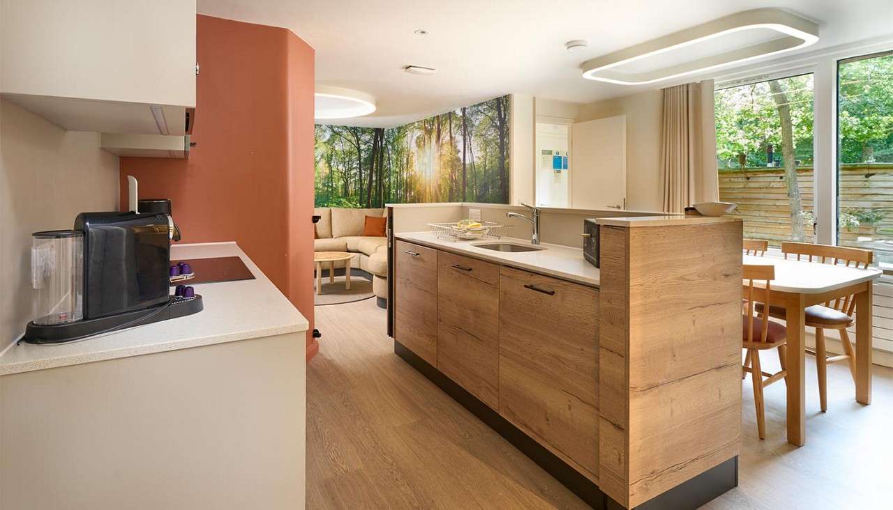 Twin bedroom with large window.