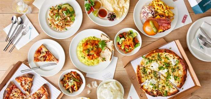 A selection of dishes from the restaurant runner menu, including: pizza, curry and burger.