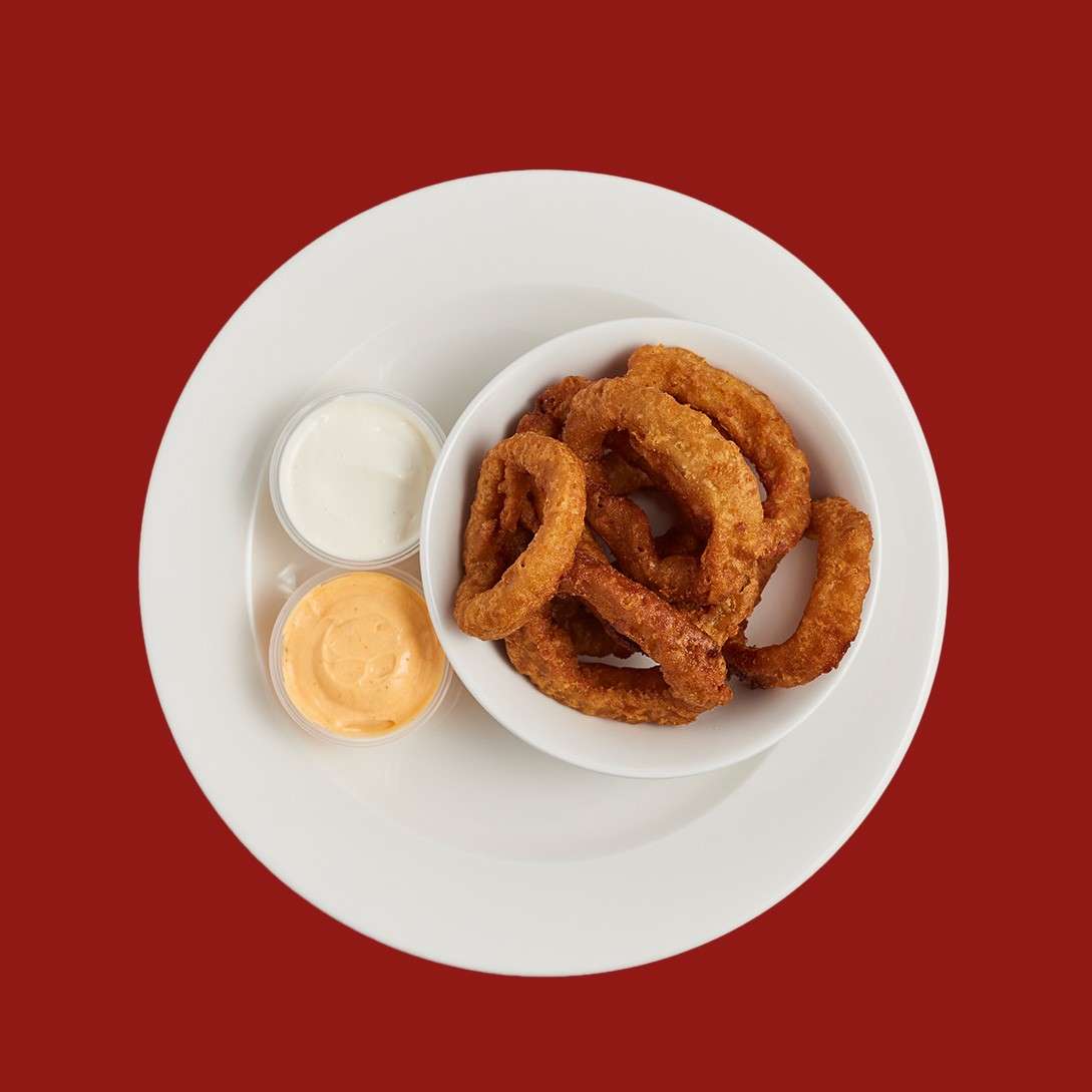Beer battered onion rings with two dipping sauces.