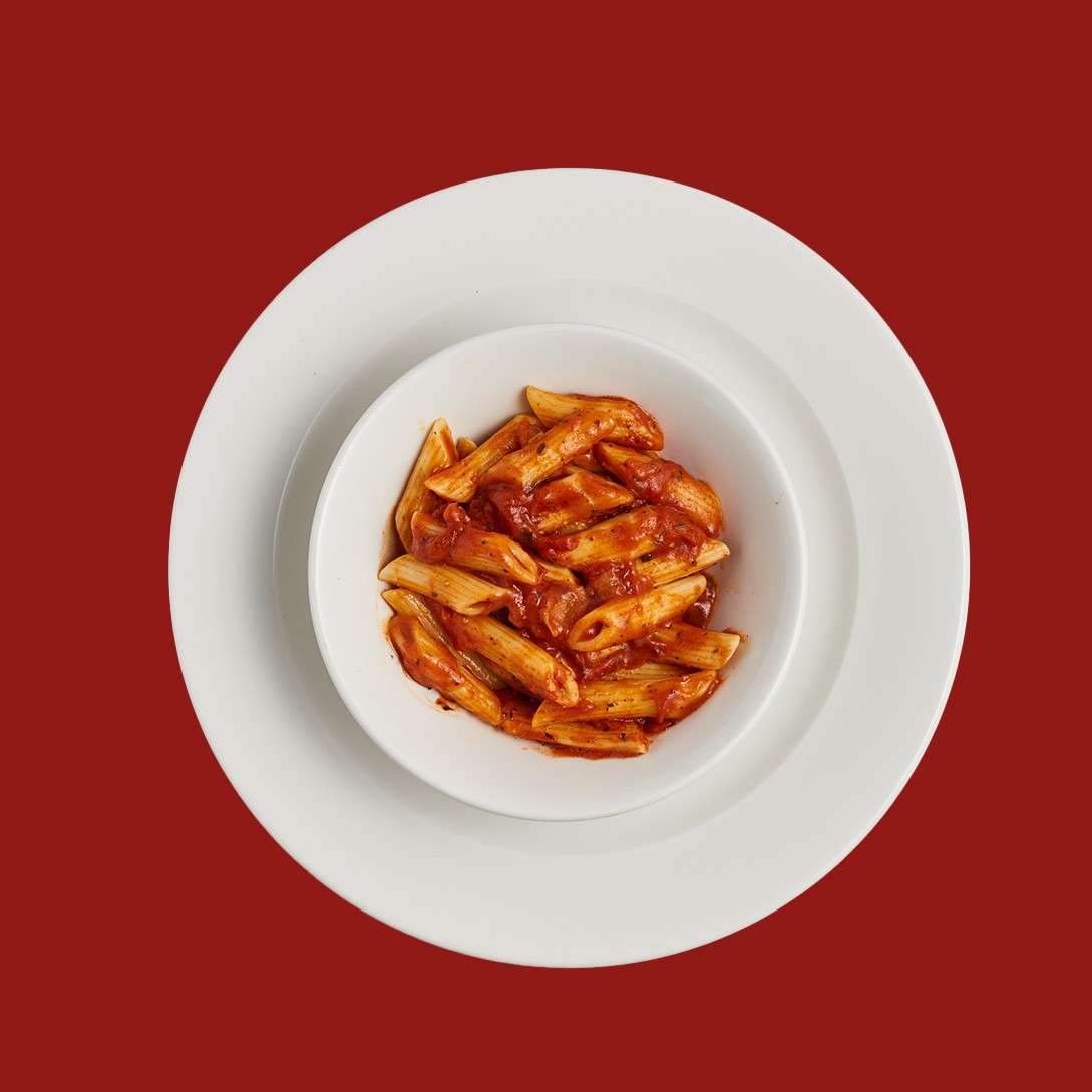 Children's portion of penne pasta in tomato sauce.