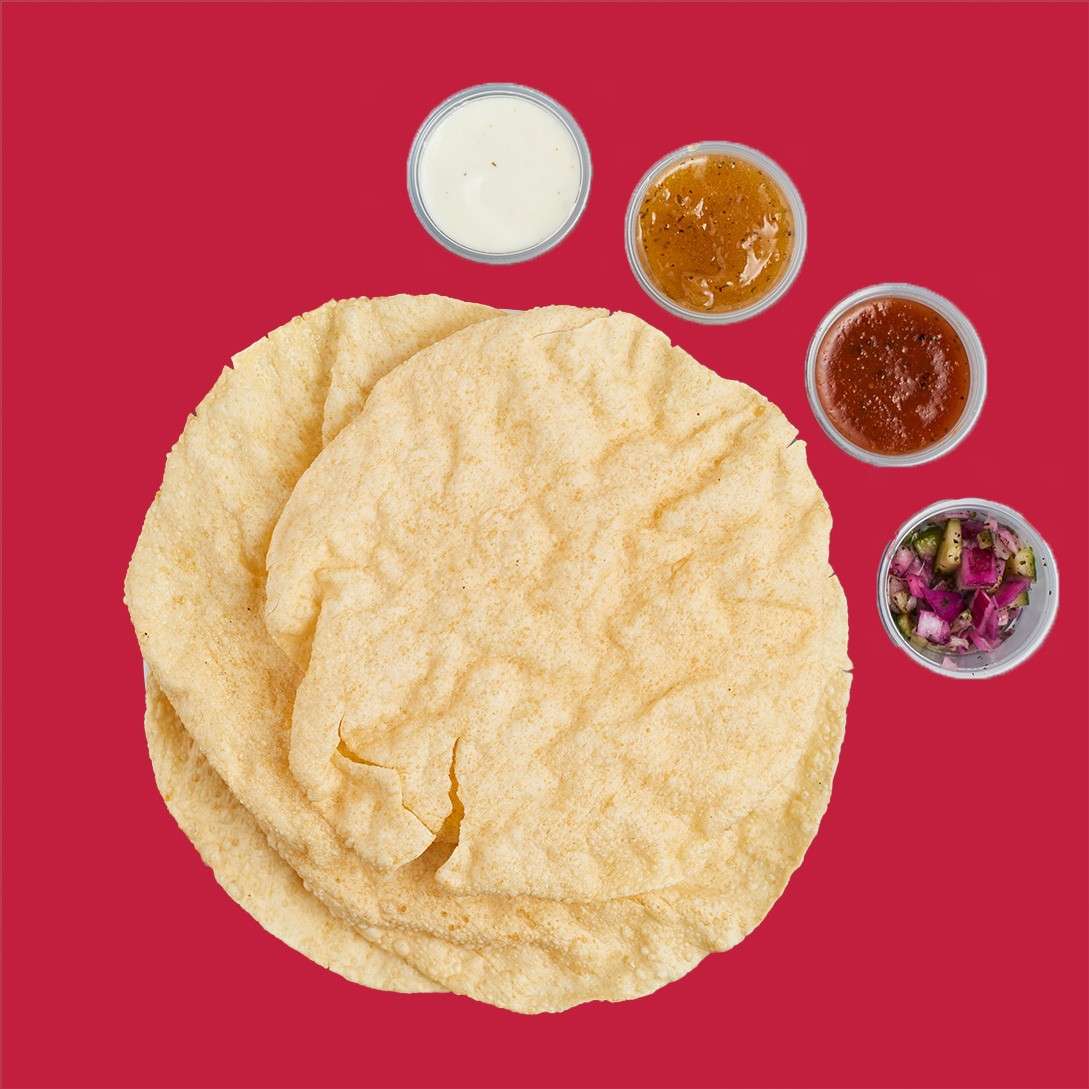 Round crispy poppadum's with four toppings;  onion salad, sweet chilli chutney, mango chutney and coriander and mint sauce.