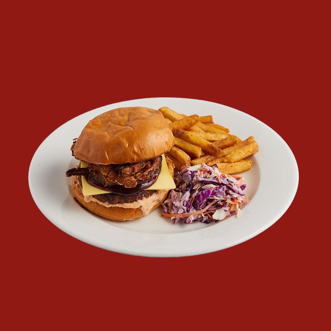 Vegan onion burger in a brioche bun. Served with fries and a crunchy slaw.