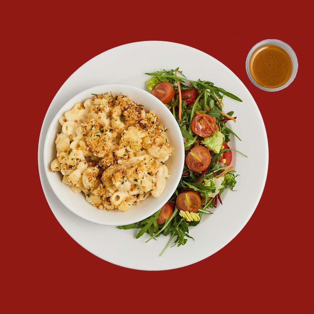 Baked mac and cheese served with a rocket, tomato, onion and charred corn salad in a lemon and garlic dressing.