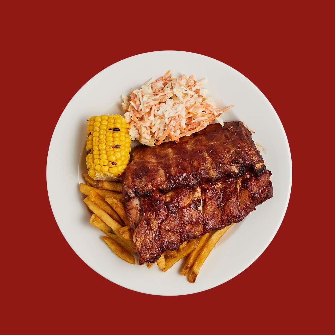 BBQ ribs with fries, grilled corn and slaw.