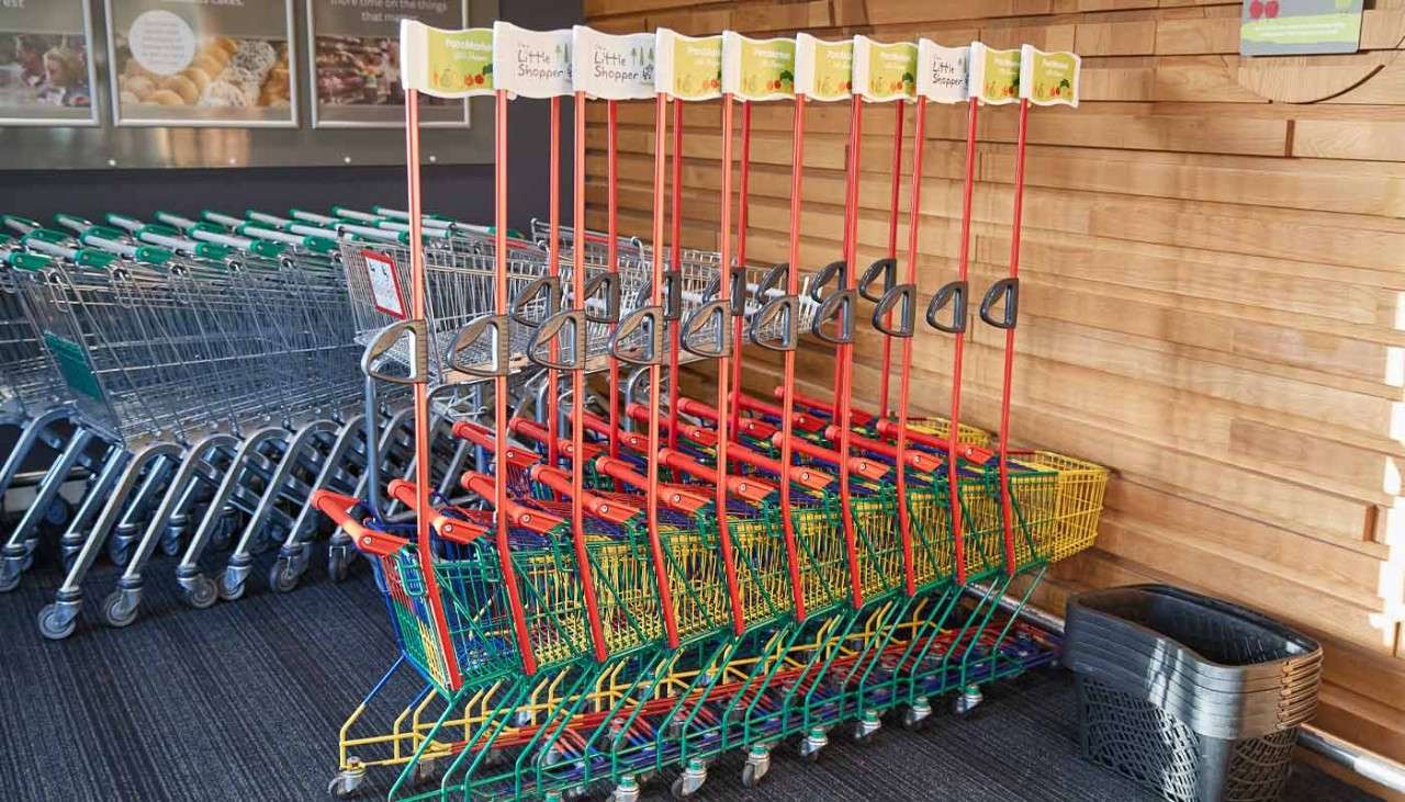 Children's trollies lined up at the Parc Market supermarket