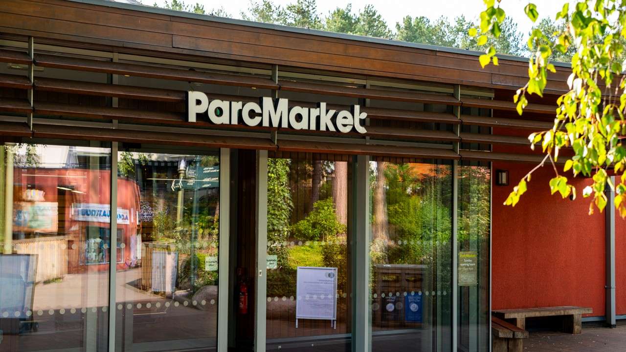 front of parc market store, with sliding opening doors