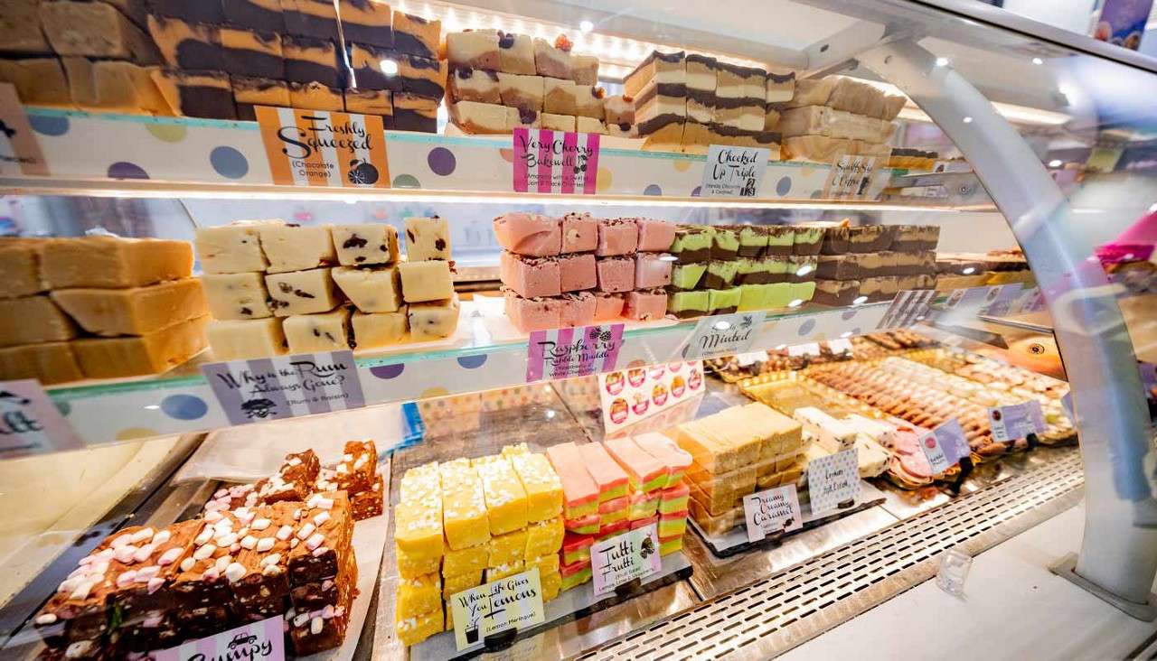 Cabinet filled with squares of sweet fudge.
