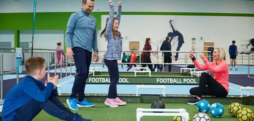 A family playing football golf