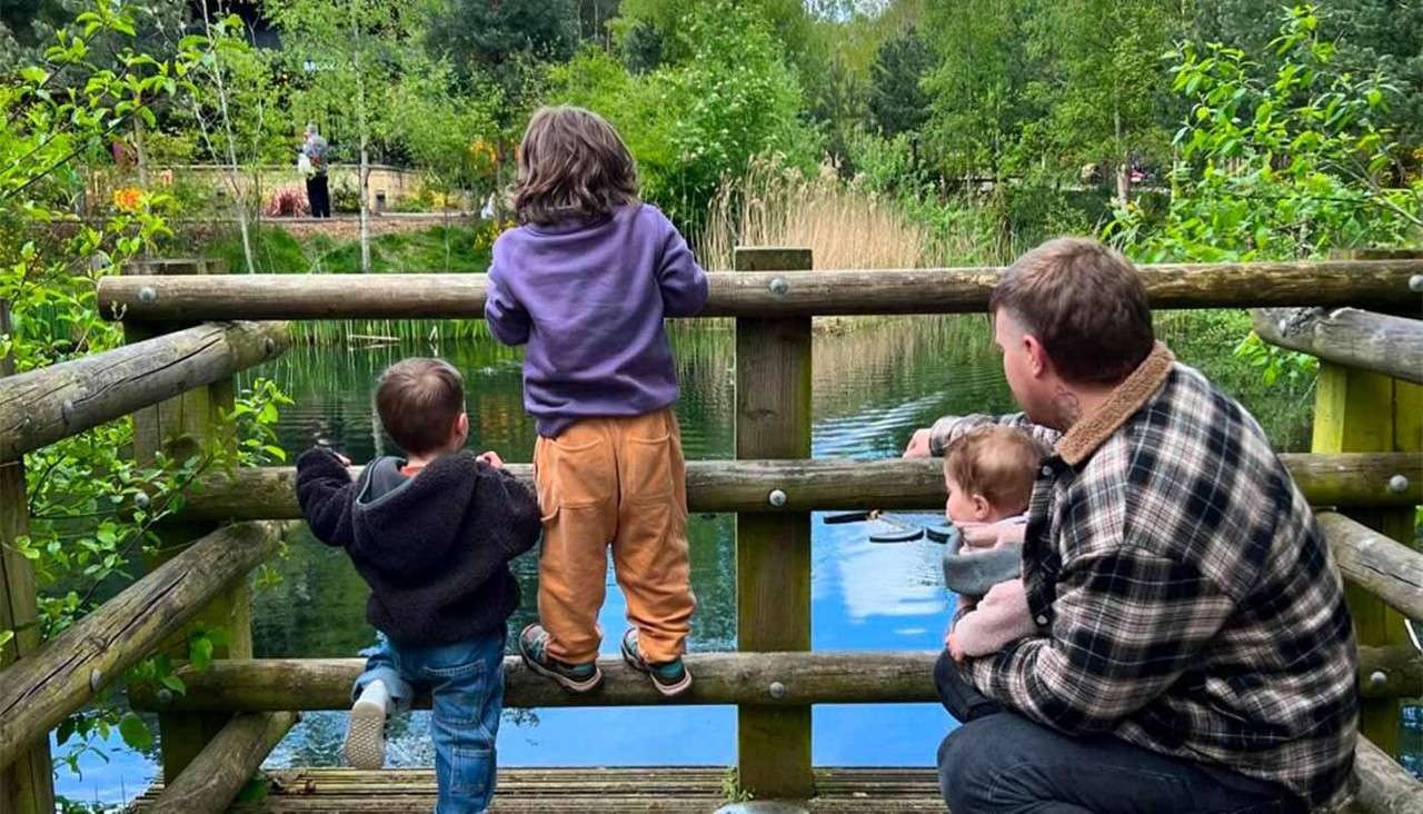 A family looking over at the lake.