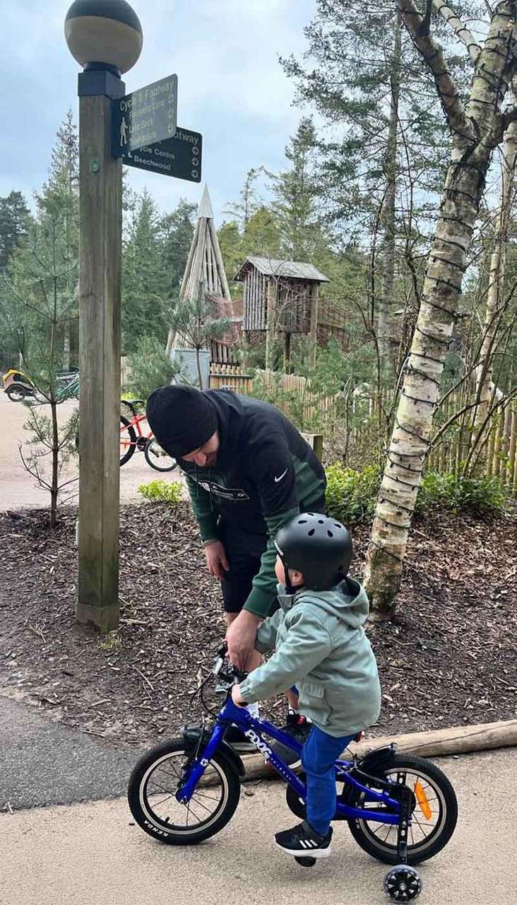 A child on a bike.
