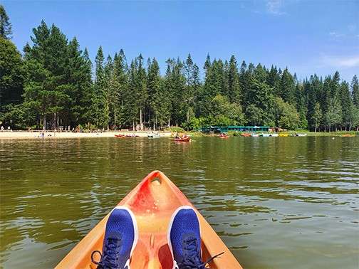 A man kayaking in the lake 