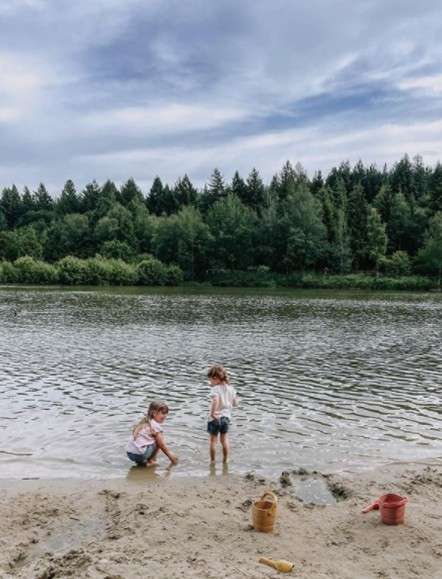 Children playing by the water on the beach 