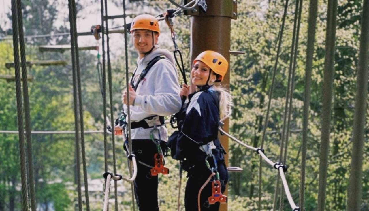 A young couple doing the Ariel Adventure.