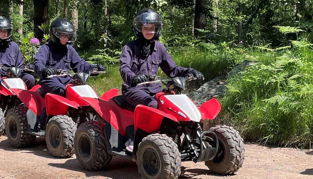 Family on quad bikes.