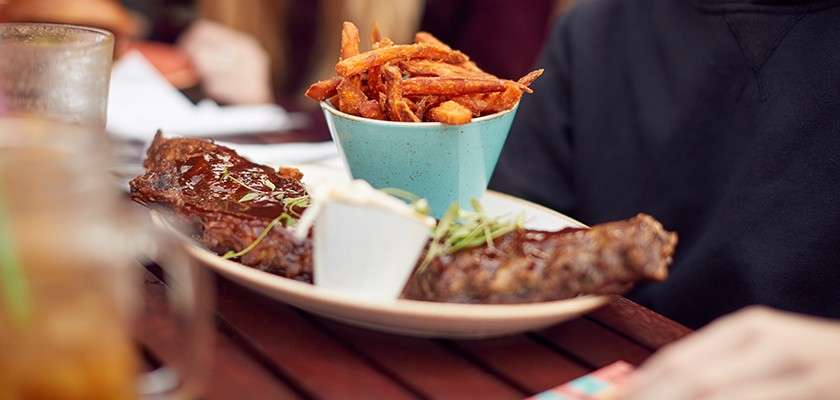 Rack of ribs with a side of sweet potato fries from a Center Parcs restaurant