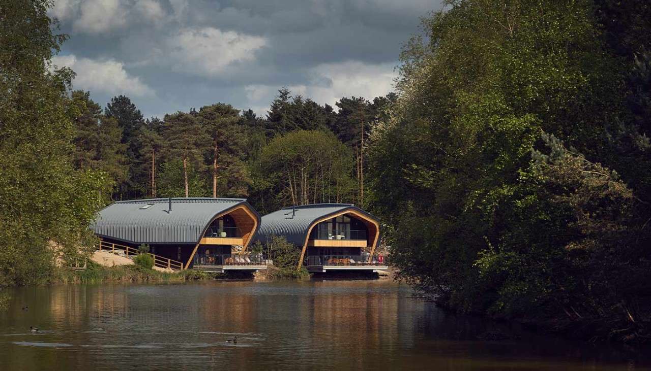 Lodges overlooking the lake at Elveden Forest.