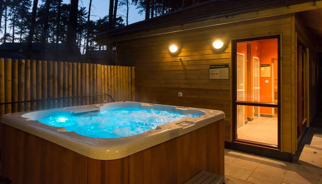 An outdoor hot tub in an Exclusive Lodge.