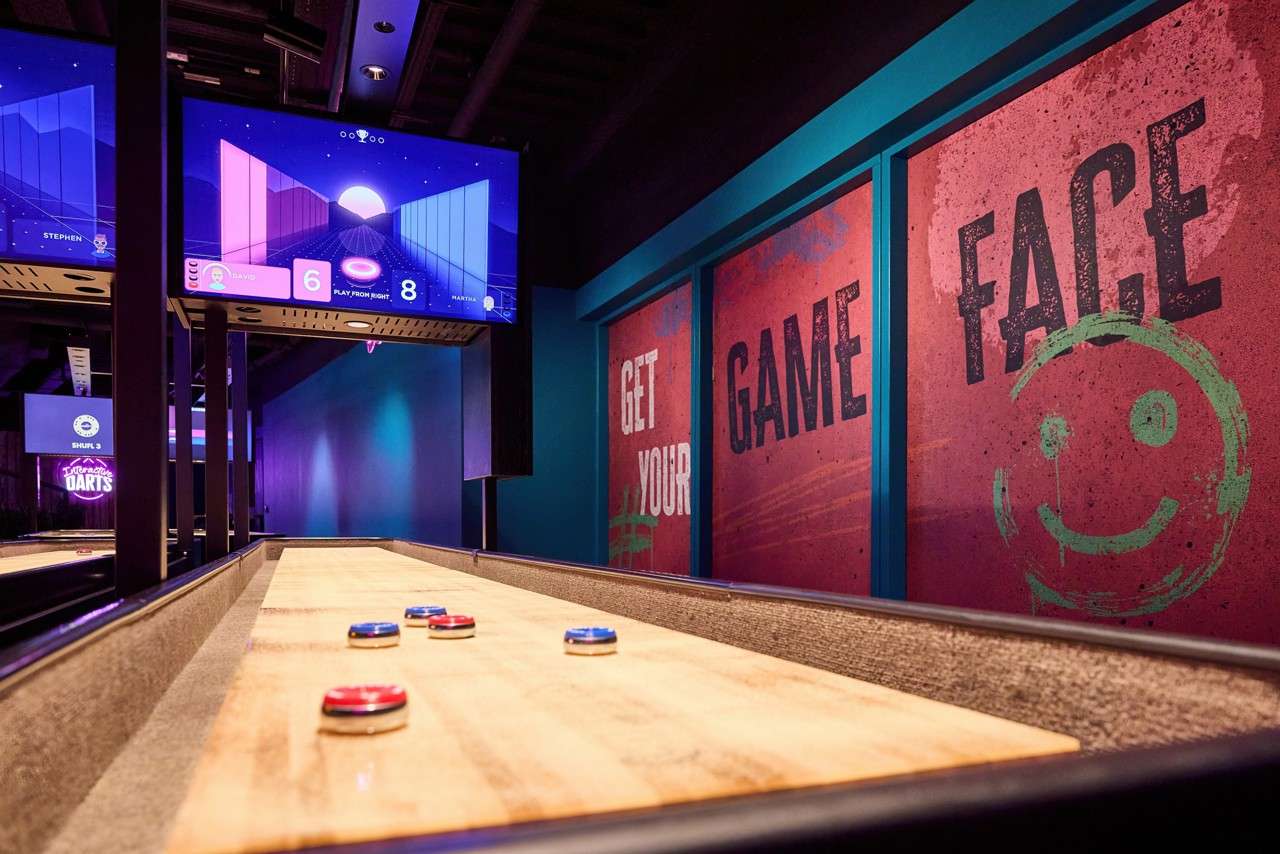 Shuffleboard pieces on a wooden table.