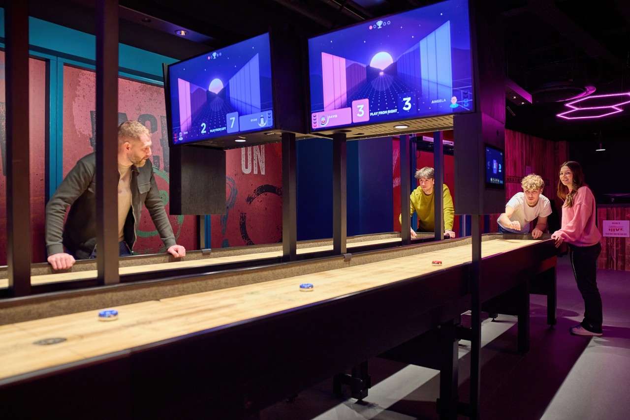Group playing Interactive Shuffleboard.