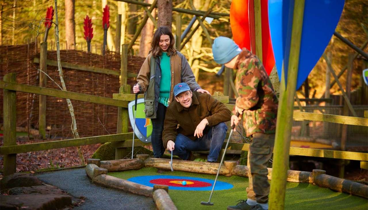 Family playing adventure golf