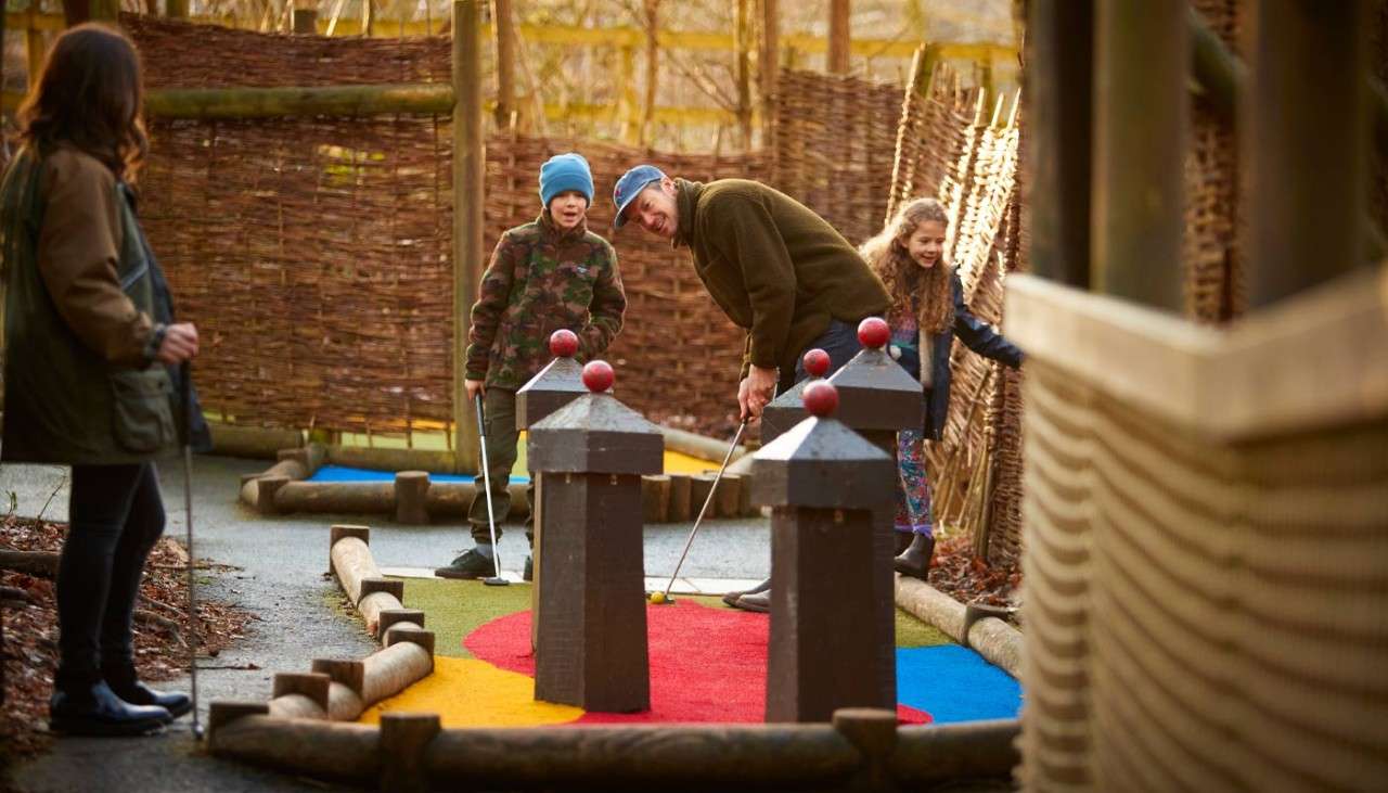 Family playing  adventure golf