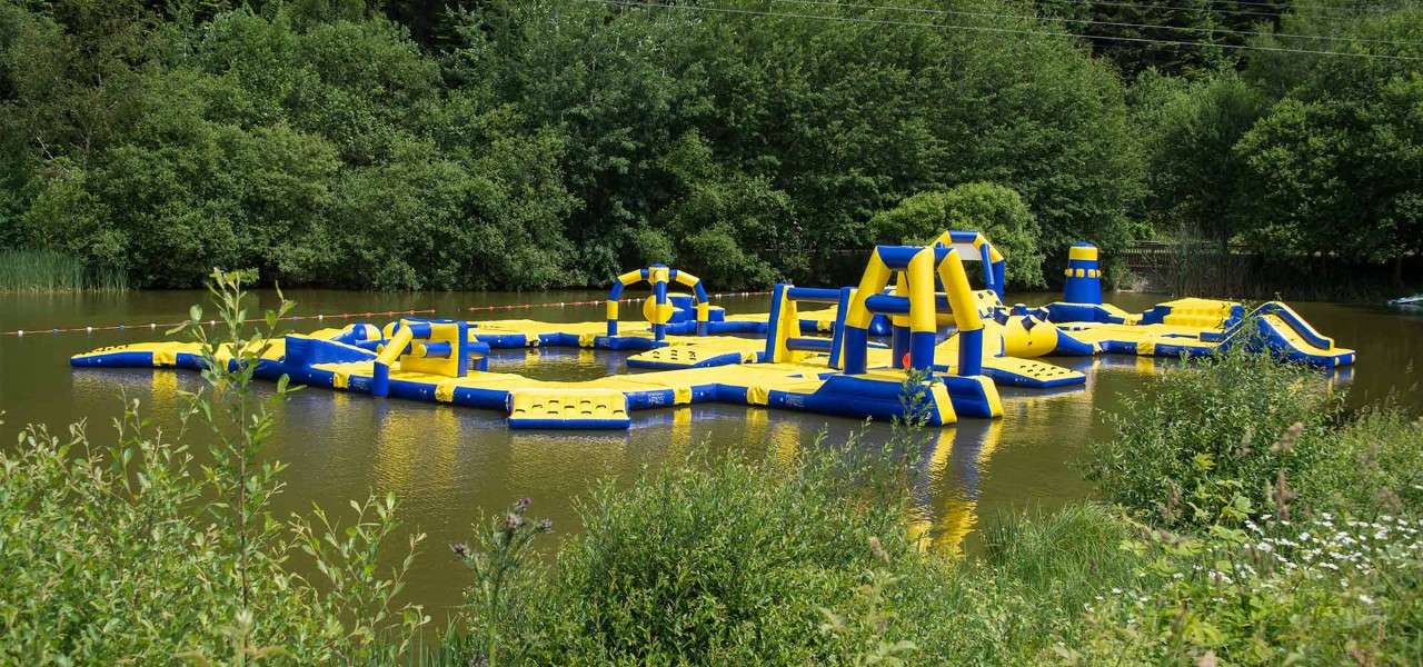 An inflatable course set up on a lake