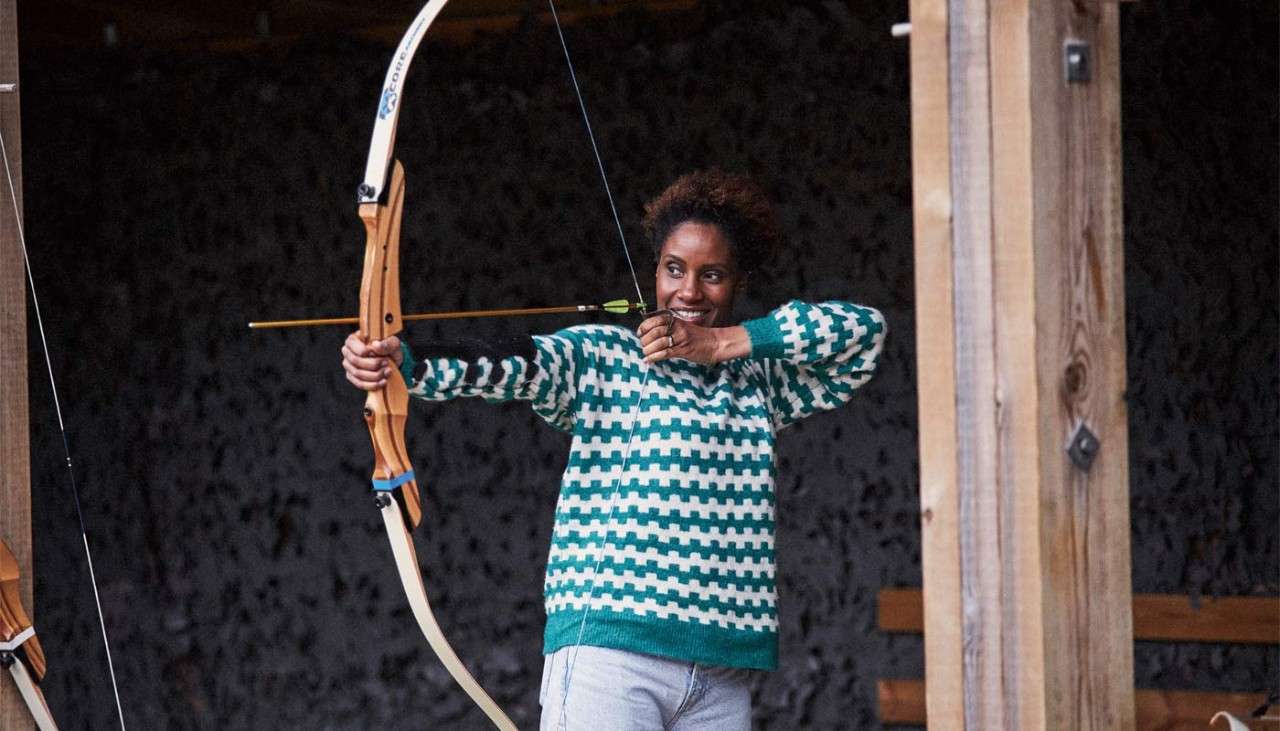 Woman aiming a bow and arrow