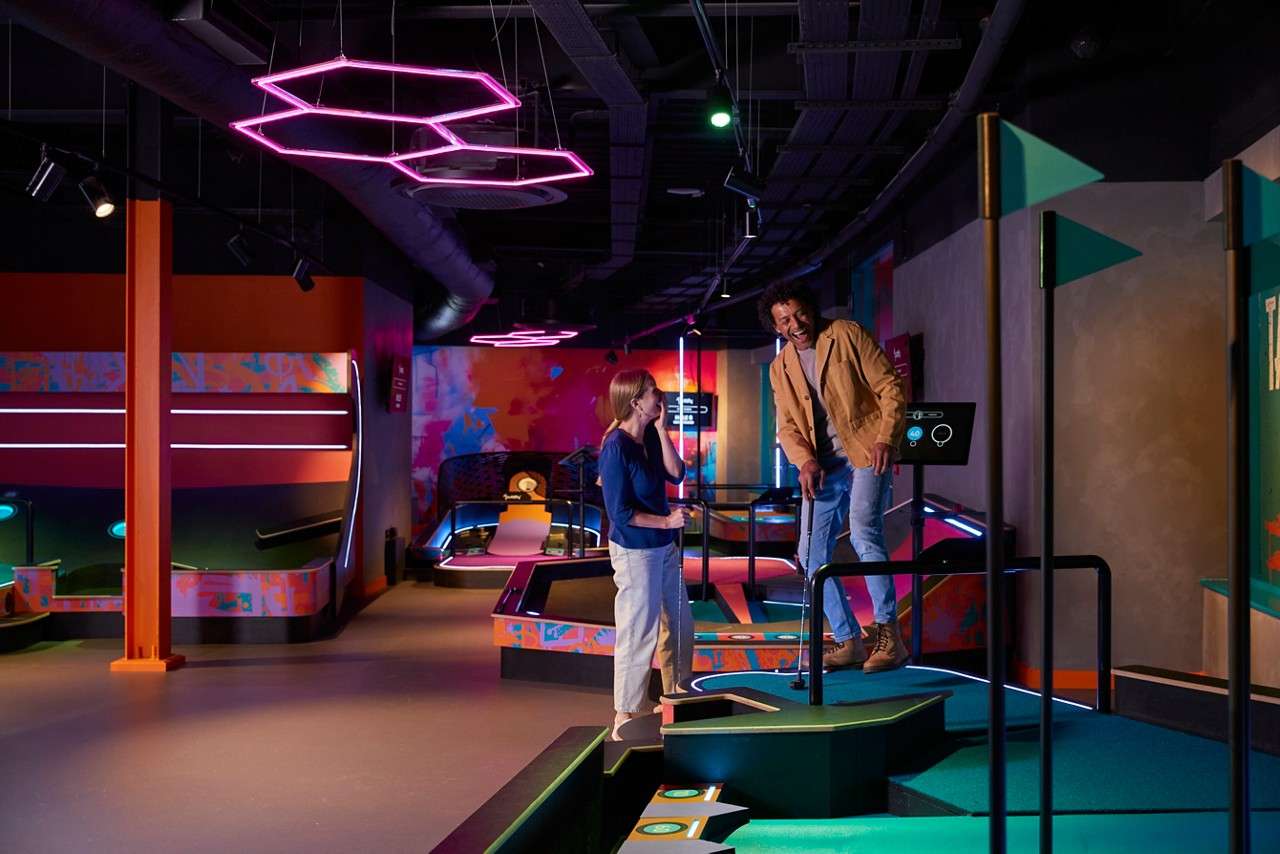 Two adults playing Puttify.