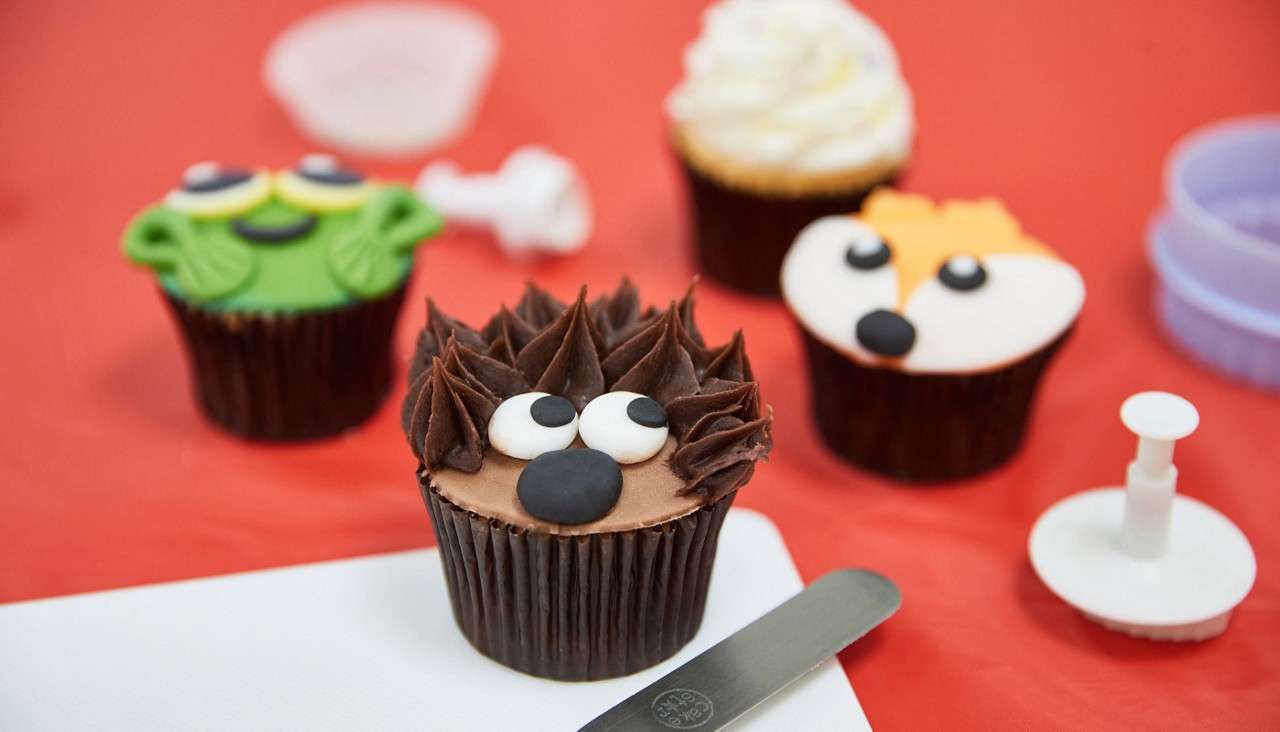Cupcakes decorated with woodland creatures.