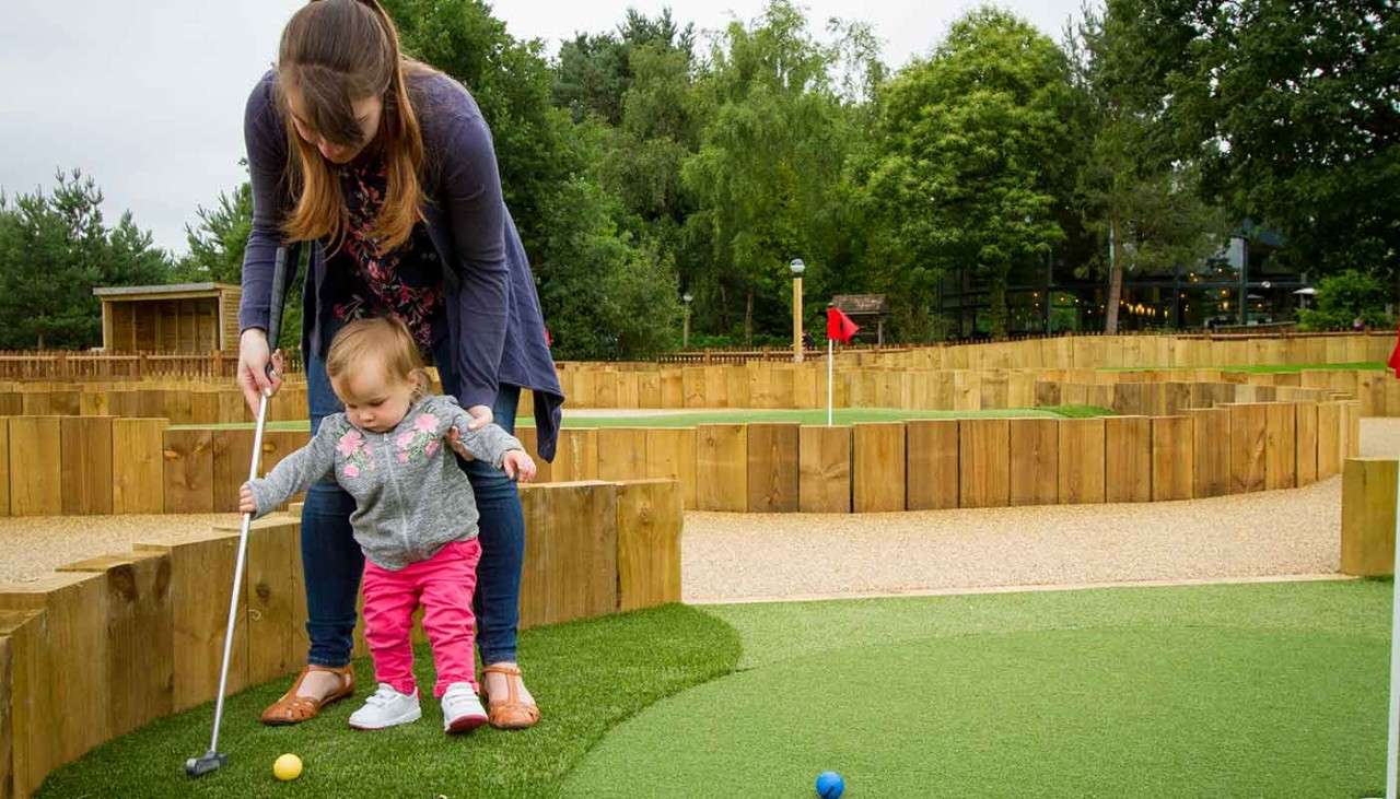 Family playing putting